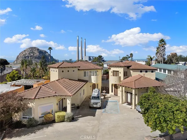 a aerial view of a house with a garden and balcony