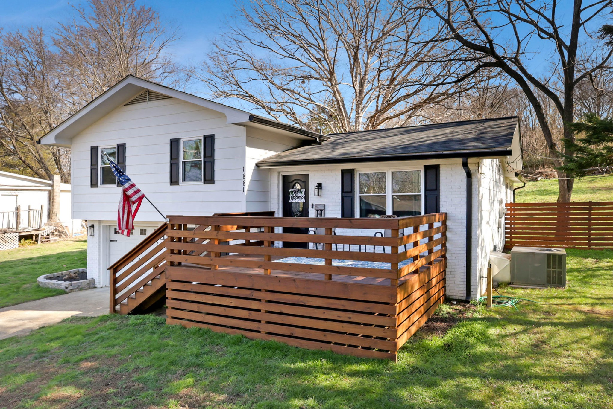 1881 Three Notch Road Ringgold, GA 30736 - Photo 4 of 27 a front view of a house with garden and wooden fence