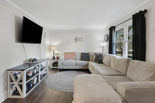 a kitchen with white cabinets and sink