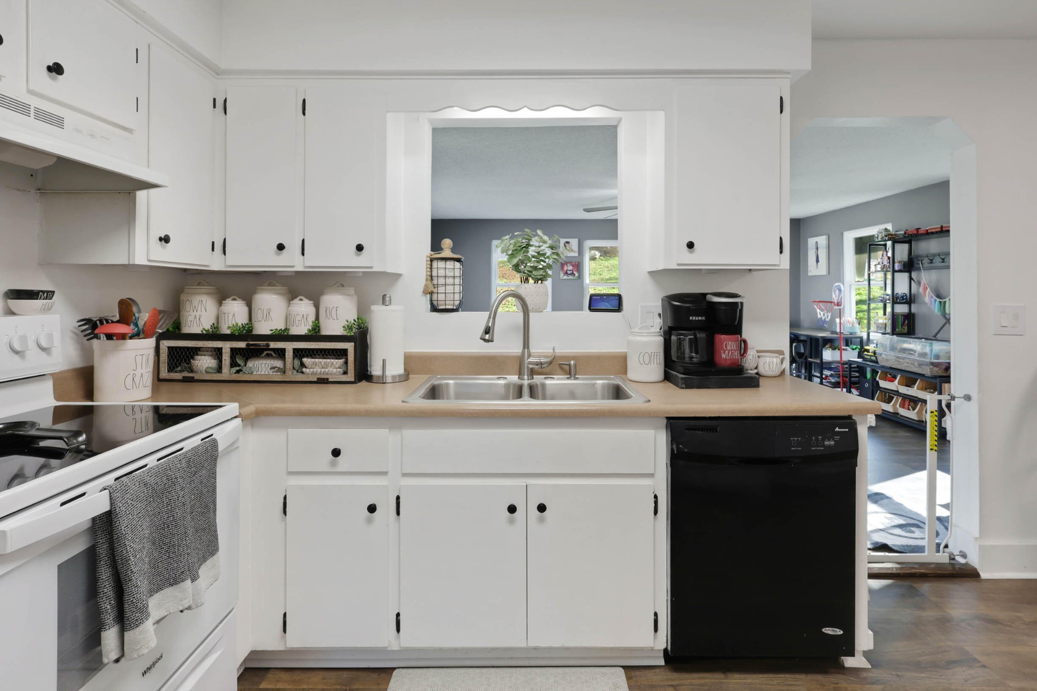 1881 Three Notch Road Ringgold, GA 30736 - Photo 8 of 27 a kitchen with white cabinets and sink