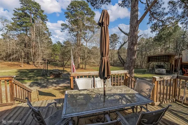 a view of a chairs and table in the patio