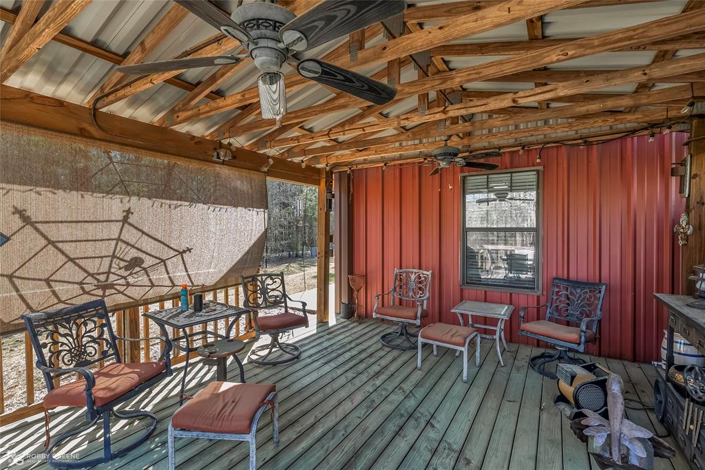 6340 Pine Hill Road Shreveport, LA 71107 - Photo 14 of 40 Wooden deck with ceiling fan