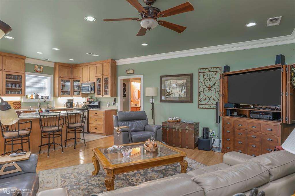 6340 Pine Hill Road Shreveport, LA 71107 - Photo 15 of 40 Living area with crown molding, recessed lighting, light wood finished floors, and a ceiling fan