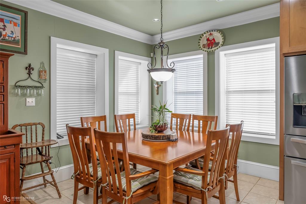 6340 Pine Hill Road Shreveport, LA 71107 - Photo 16 of 40 Dining room featuring crown molding and light tile patterned floors