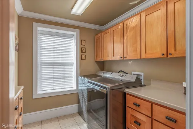 a bathroom with a granite countertop toilet a sink a mirror and a window