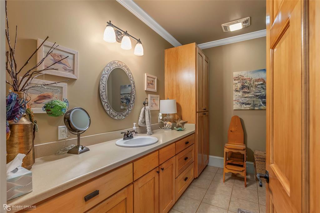 6340 Pine Hill Road Shreveport, LA 71107 - Photo 23 of 40 Bathroom with ornamental molding, vanity, and light tile patterned floors