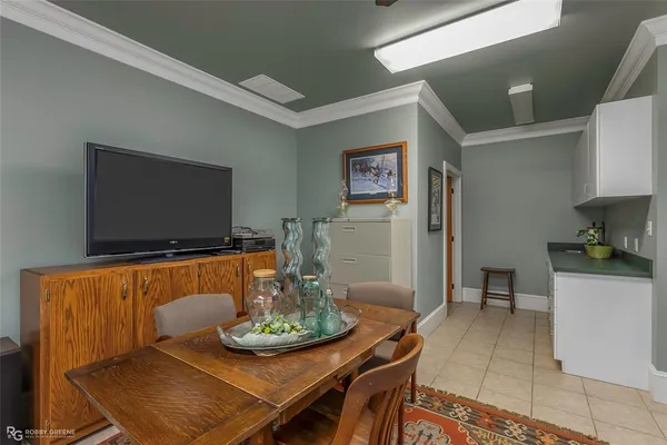 a dining room with furniture and window