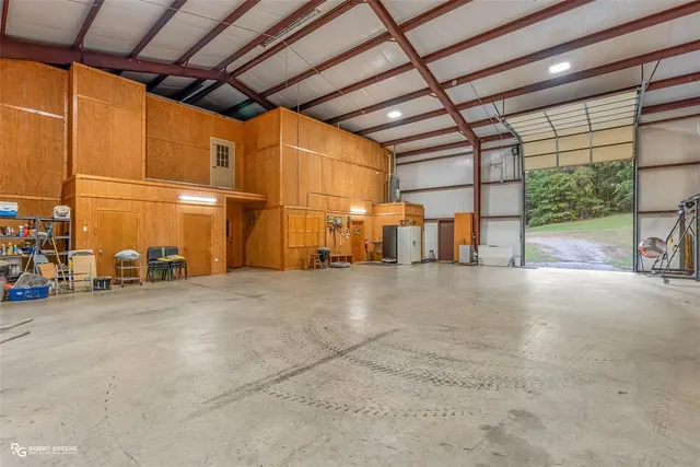 a view of a empty room with a garage