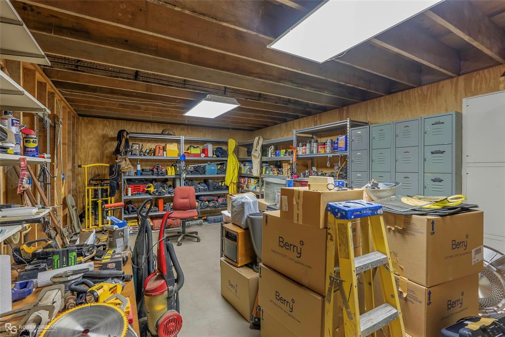 6340 Pine Hill Road Shreveport, LA 71107 - Photo 37 of 40 Basement featuring wood walls and a workshop area
