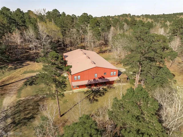 a view of a chair and table in the backyard