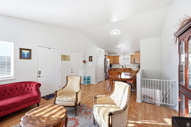 1662 East Ridgefield Road Spanish Fork, UT 84660 - Photo 5 of 18 Vaulted ceilings enhance this living area featuring wood-finish flooring and recessed lighting