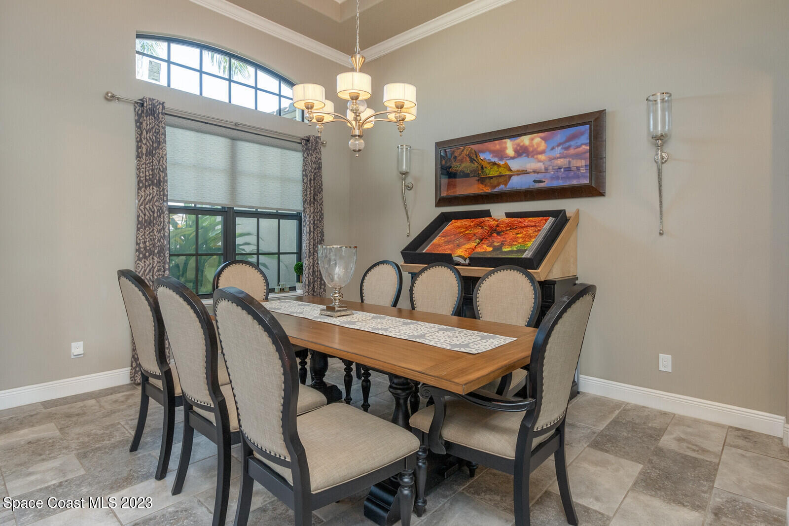 5107 Kirkwall Circle Melbourne, FL 32940 - Photo 16 of 44 a view of a dining room with furniture a chandelier and wooden floor