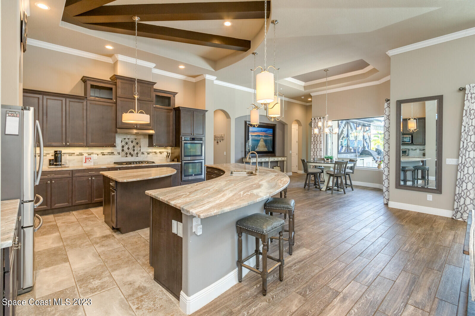 5107 Kirkwall Circle Melbourne, FL 32940 - Photo 21 of 44 a kitchen with a sink counter top space and stainless steel appliances