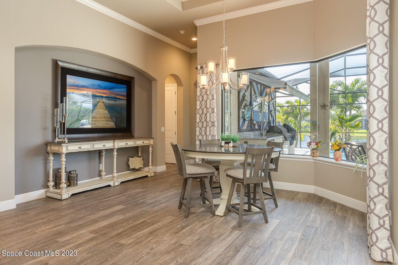 5107 Kirkwall Circle Melbourne, FL 32940 - Photo 26 of 44 a view of a dining room with furniture window and wooden floor
