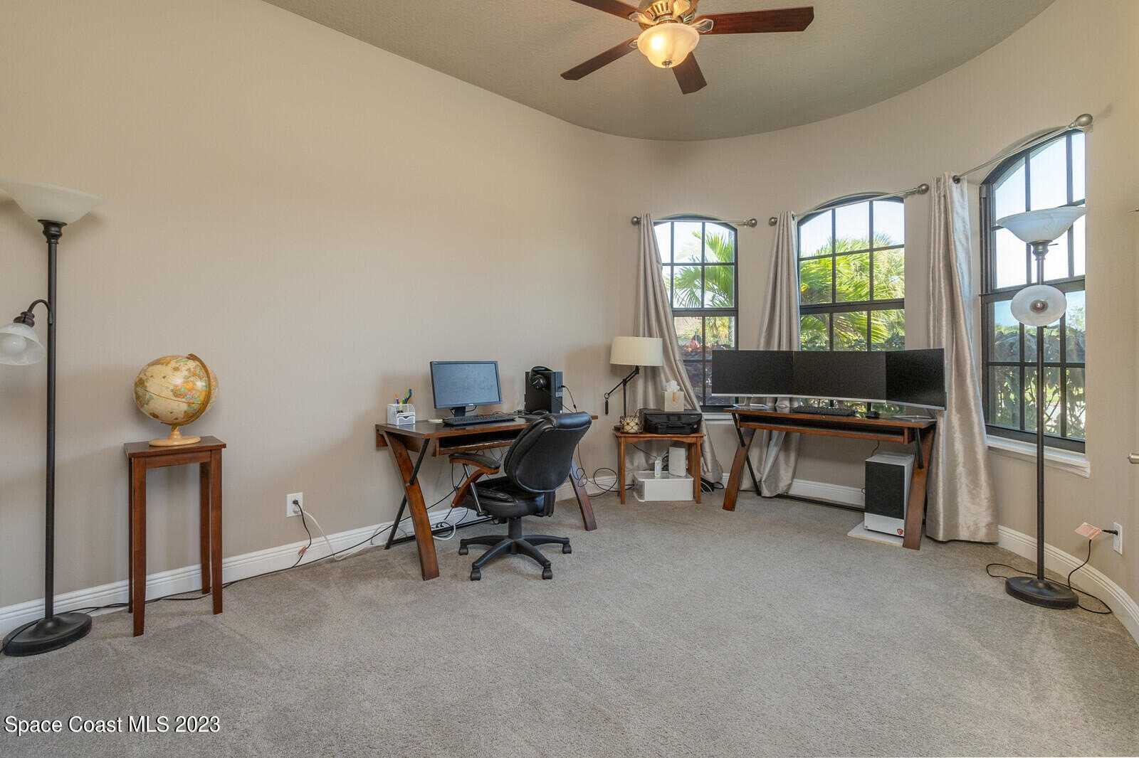 5107 Kirkwall Circle Melbourne, FL 32940 - Photo 37 of 44 a view of a workspace with furniture and a window