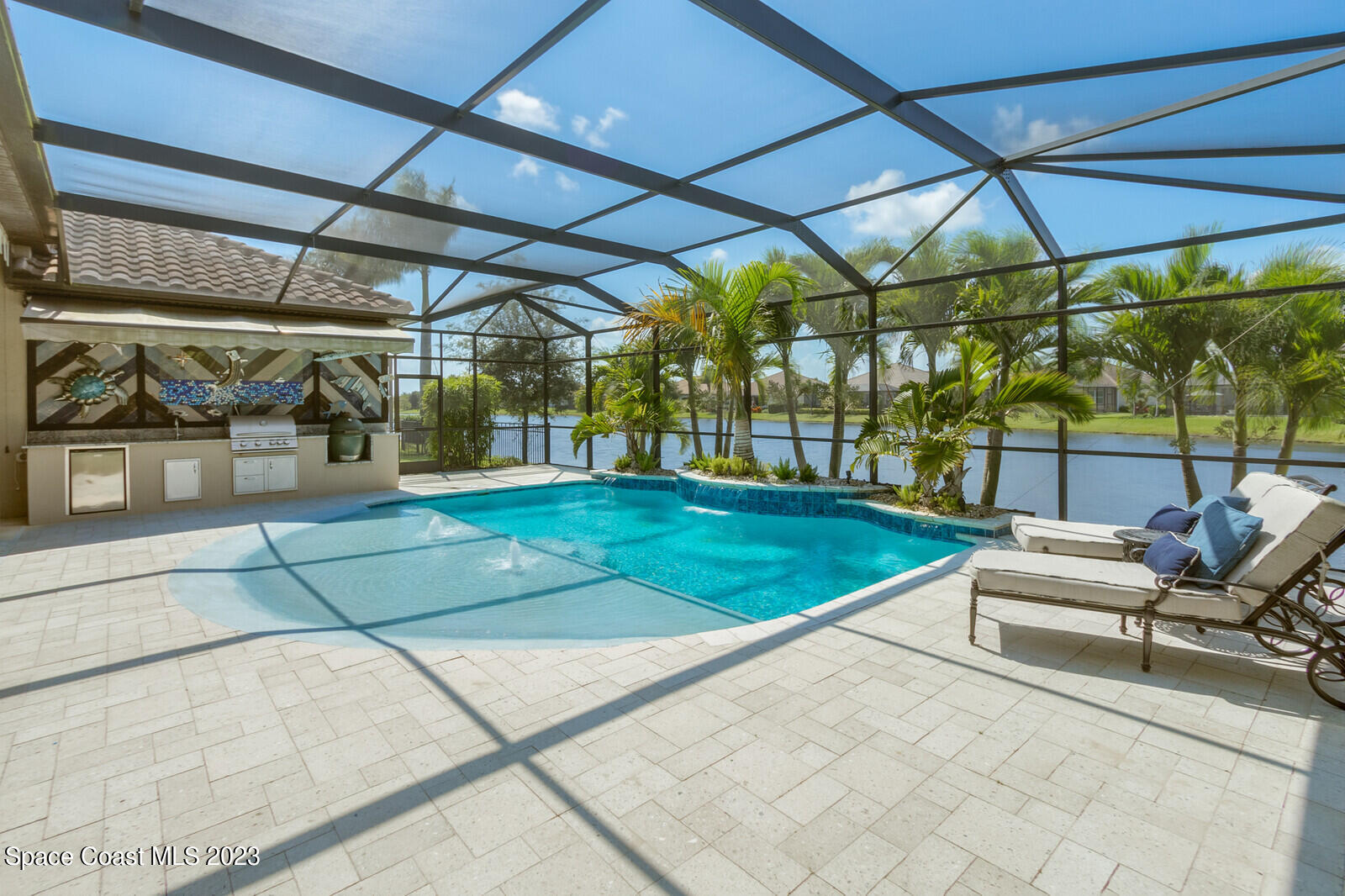 5107 Kirkwall Circle Melbourne, FL 32940 - Photo 8 of 44 a view of a patio with a table and chairs under an umbrella