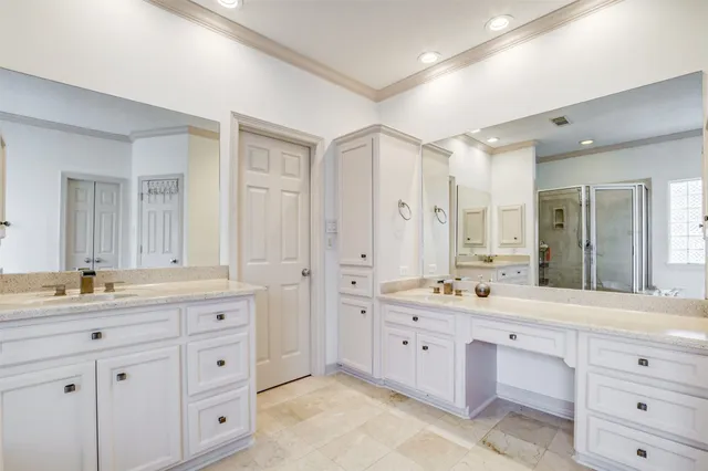 a bathroom with a double vanity sink mirror and double