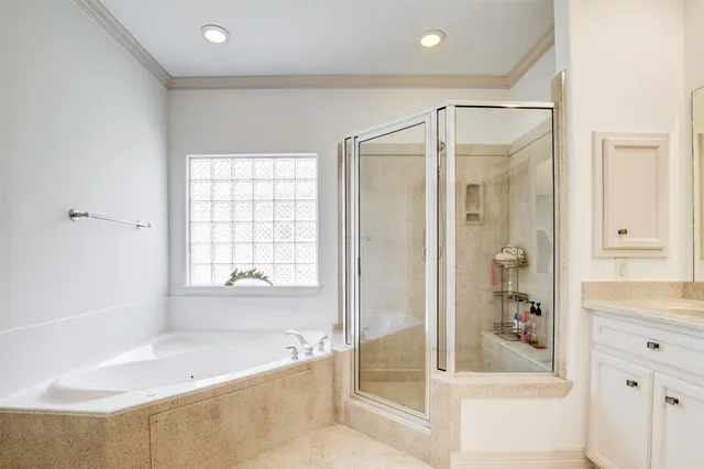 a bathroom with a bathtub and a shower