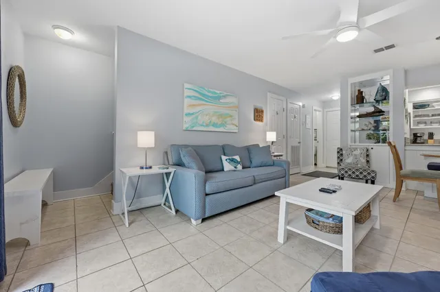a living room with furniture and white walls