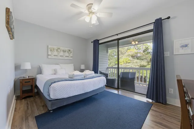 a spacious bedroom with a bed and a large window