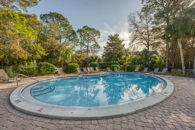 a view of a swimming pool with a yard