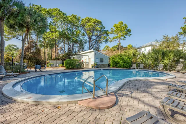 a view of a swimming pool with a patio