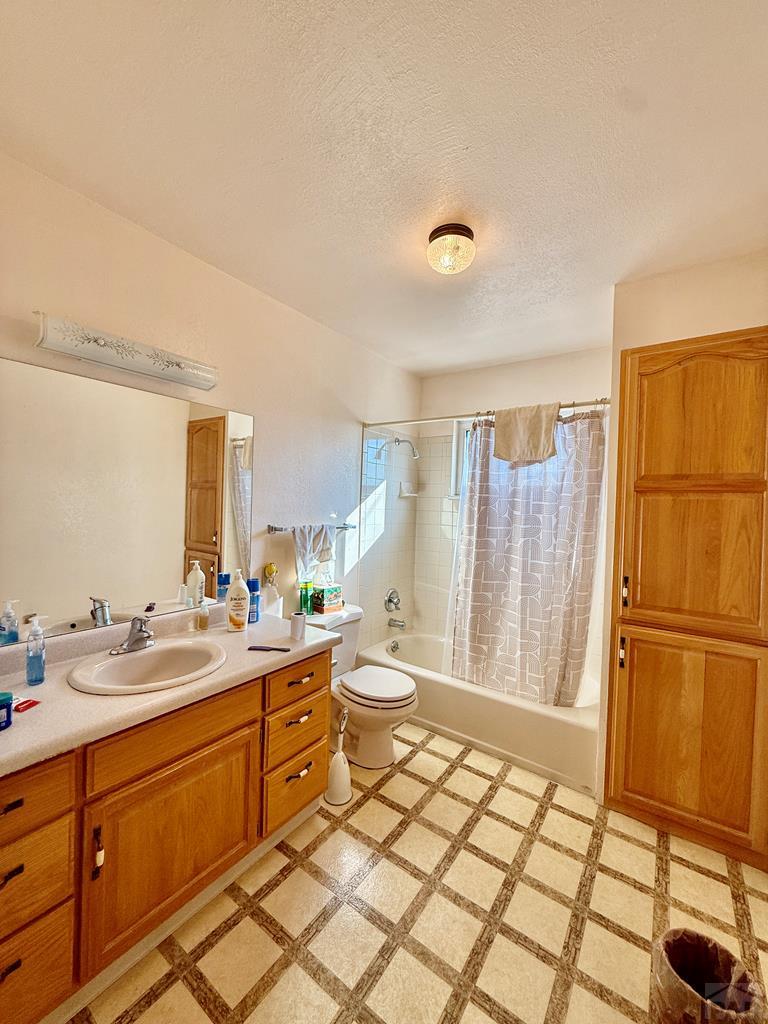 6216 Moreland Road Boone, CO 81025 - Photo 21 of 40 a large bathroom with a double vanity sink a mirror and a shower