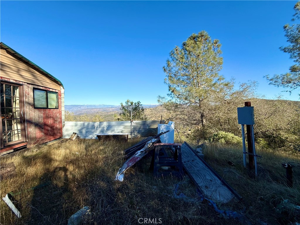 5847 West Whitlock Road Mariposa, CA 95338 - Photo 31 of 33 a view of a house with a yard