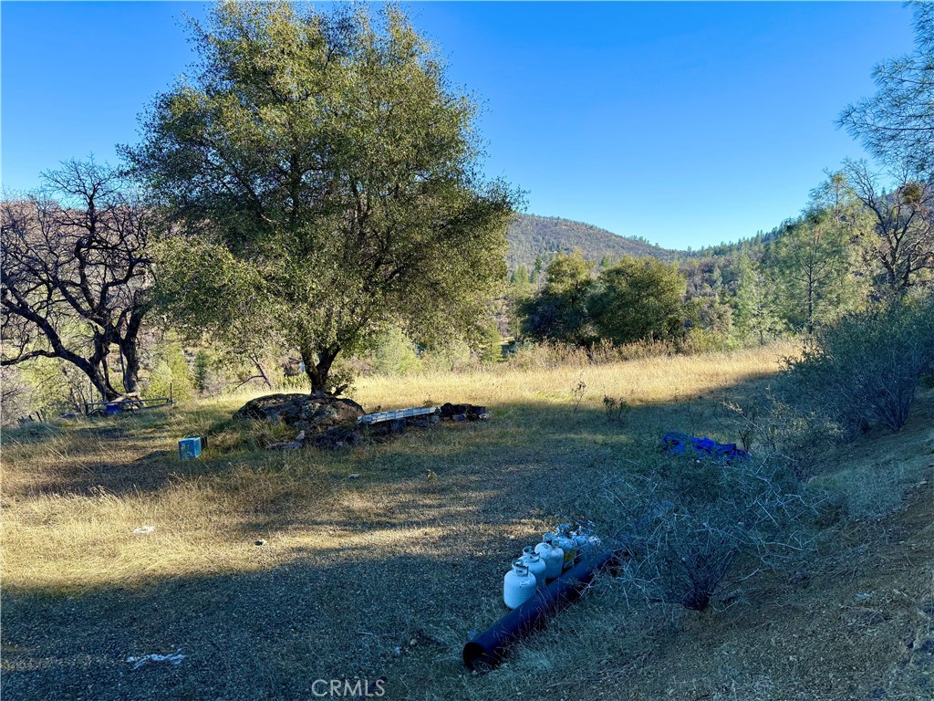 5847 West Whitlock Road Mariposa, CA 95338 - Photo 9 of 33 a view of a lake with a mountain