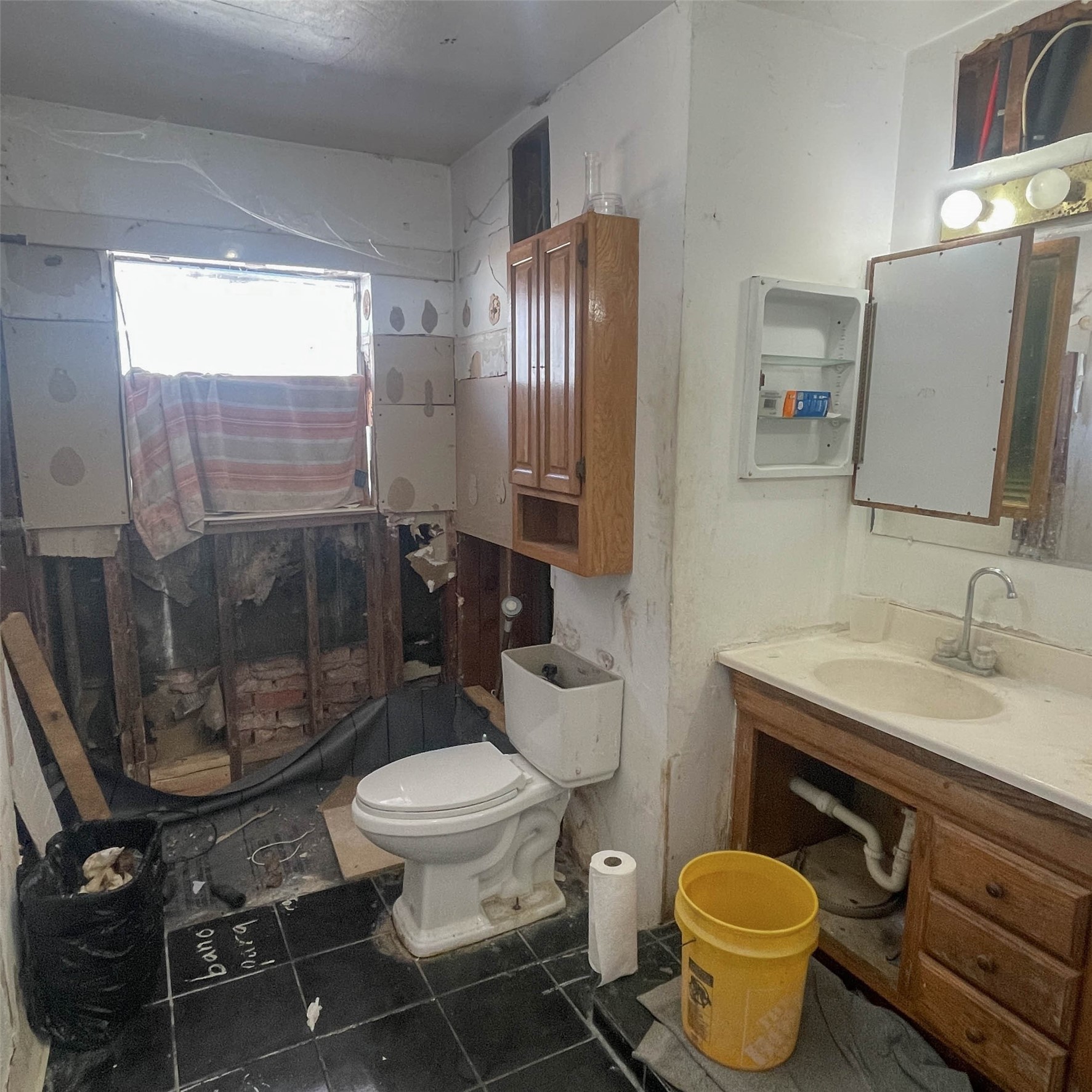 255 McFarland Road Houston, TX 77060 - Photo 11 of 28 a bathroom with a granite countertop toilet sink and mirror