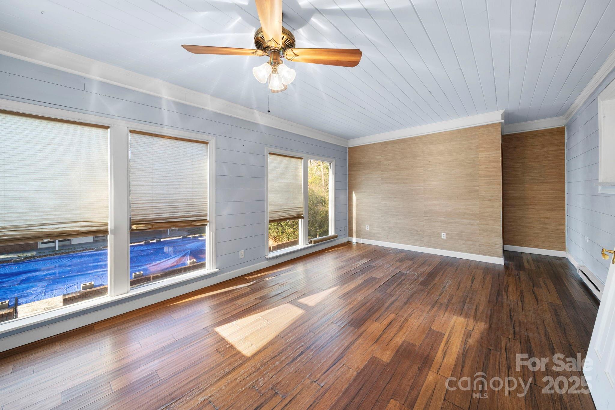 415 Love Lane Rockingham, NC 28379 - Photo 19 of 46 wooden floor in an empty room with a window