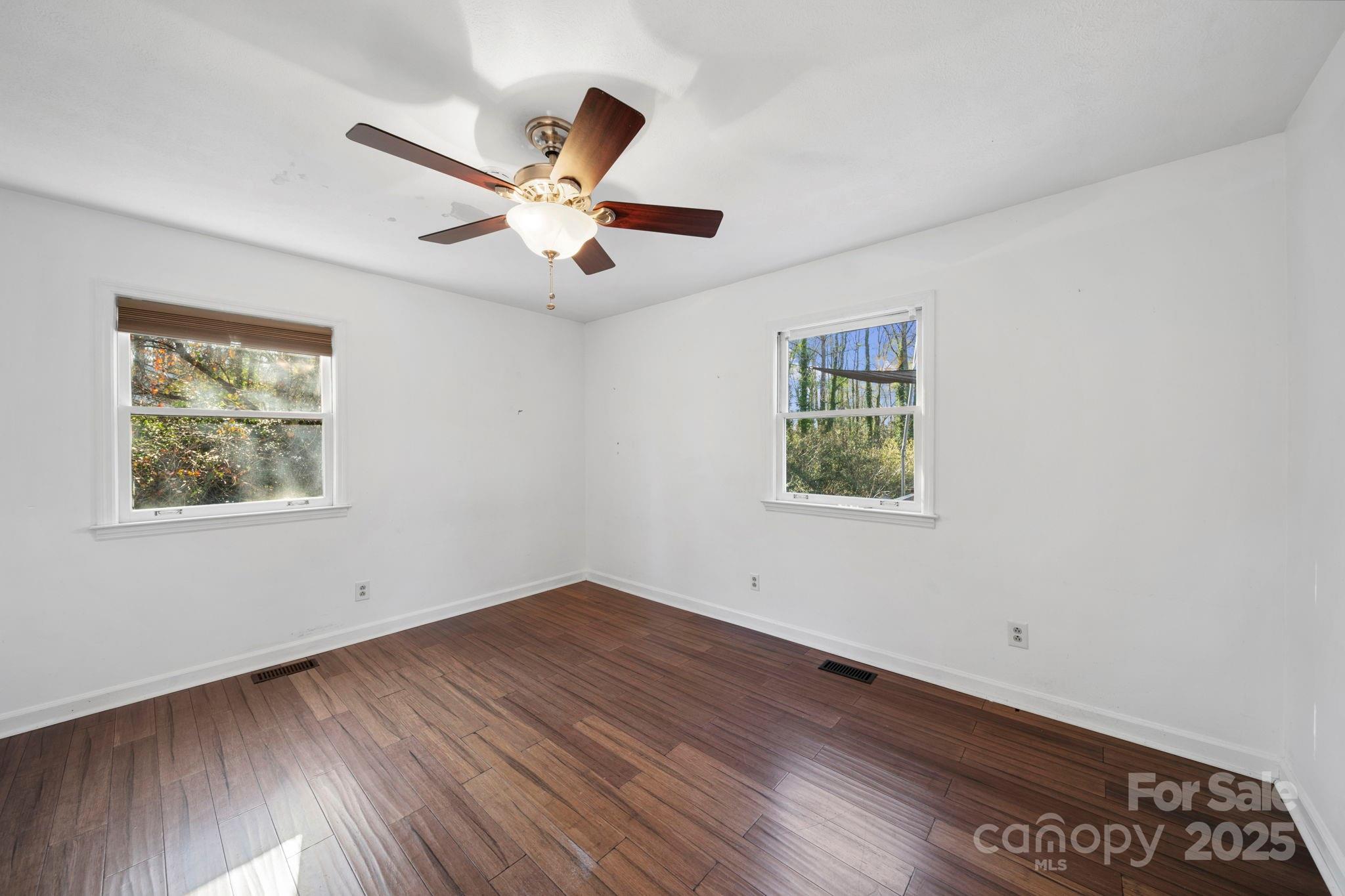 415 Love Lane Rockingham, NC 28379 - Photo 23 of 46 a view of empty room with wooden floor