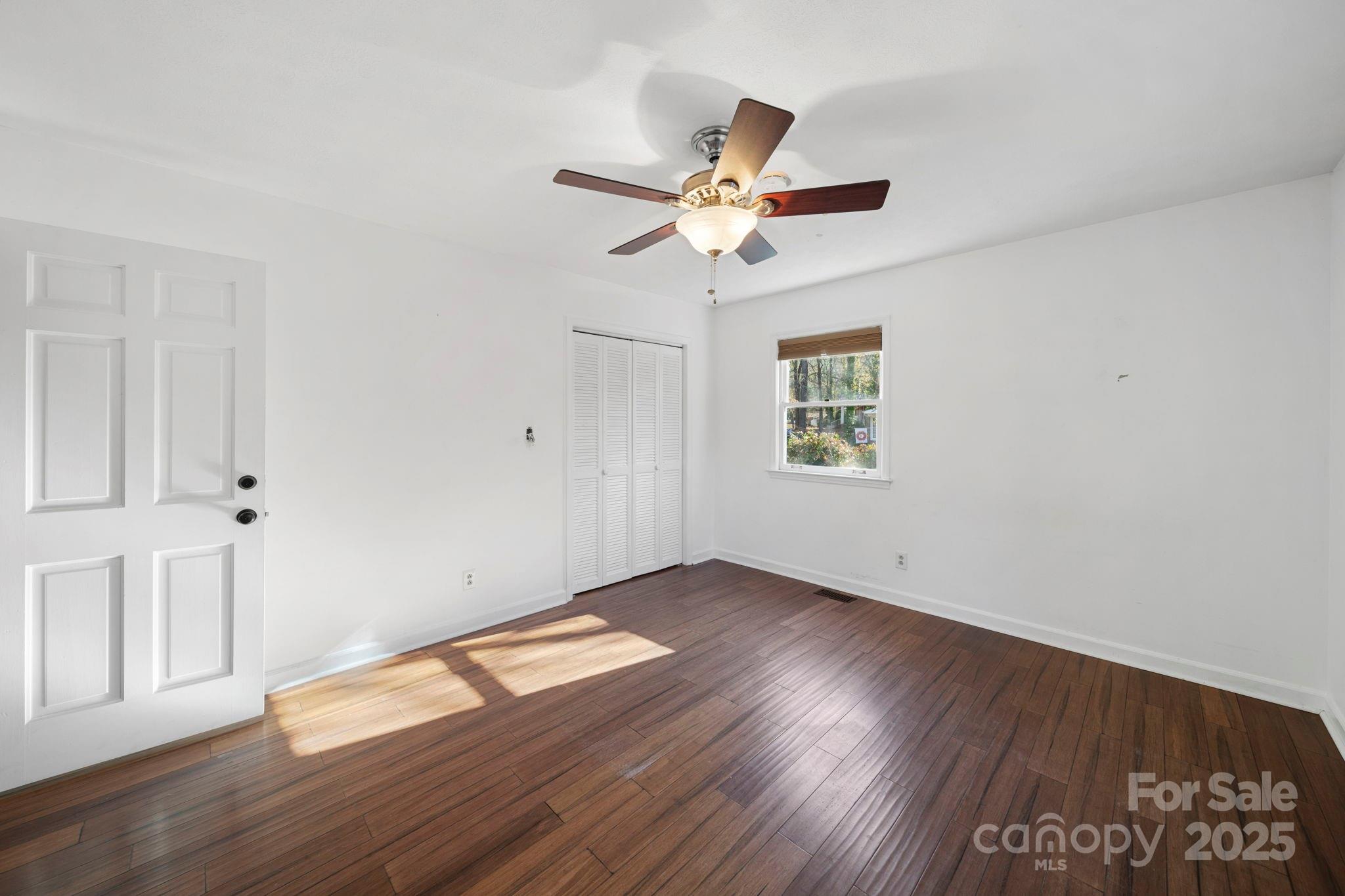 415 Love Lane Rockingham, NC 28379 - Photo 24 of 46 a view of empty room with wooden floor and fan
