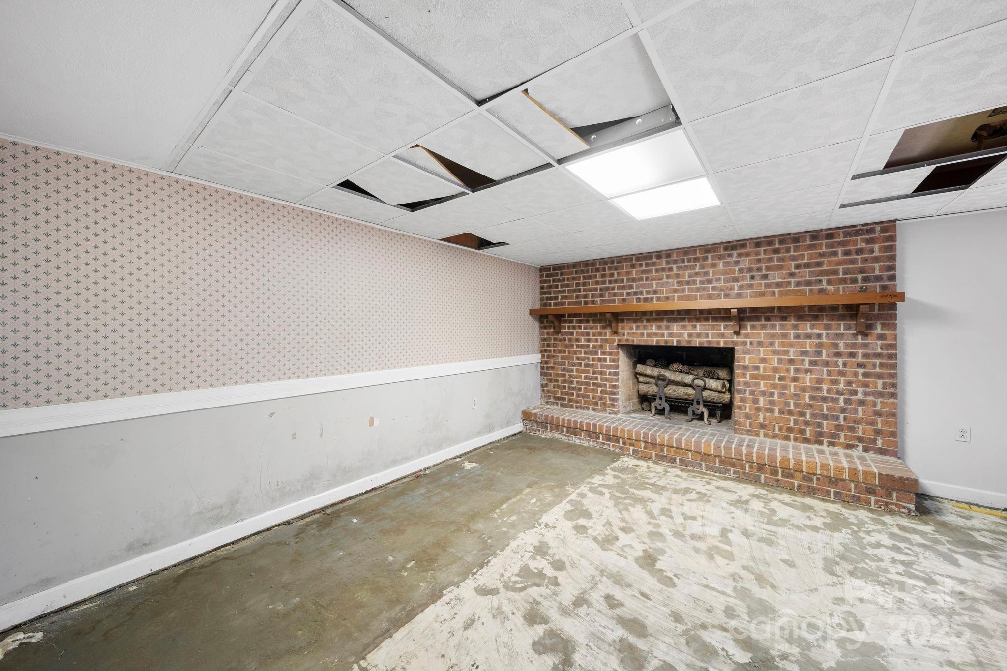 415 Love Lane Rockingham, NC 28379 - Photo 25 of 46 a view of empty room with a fireplace