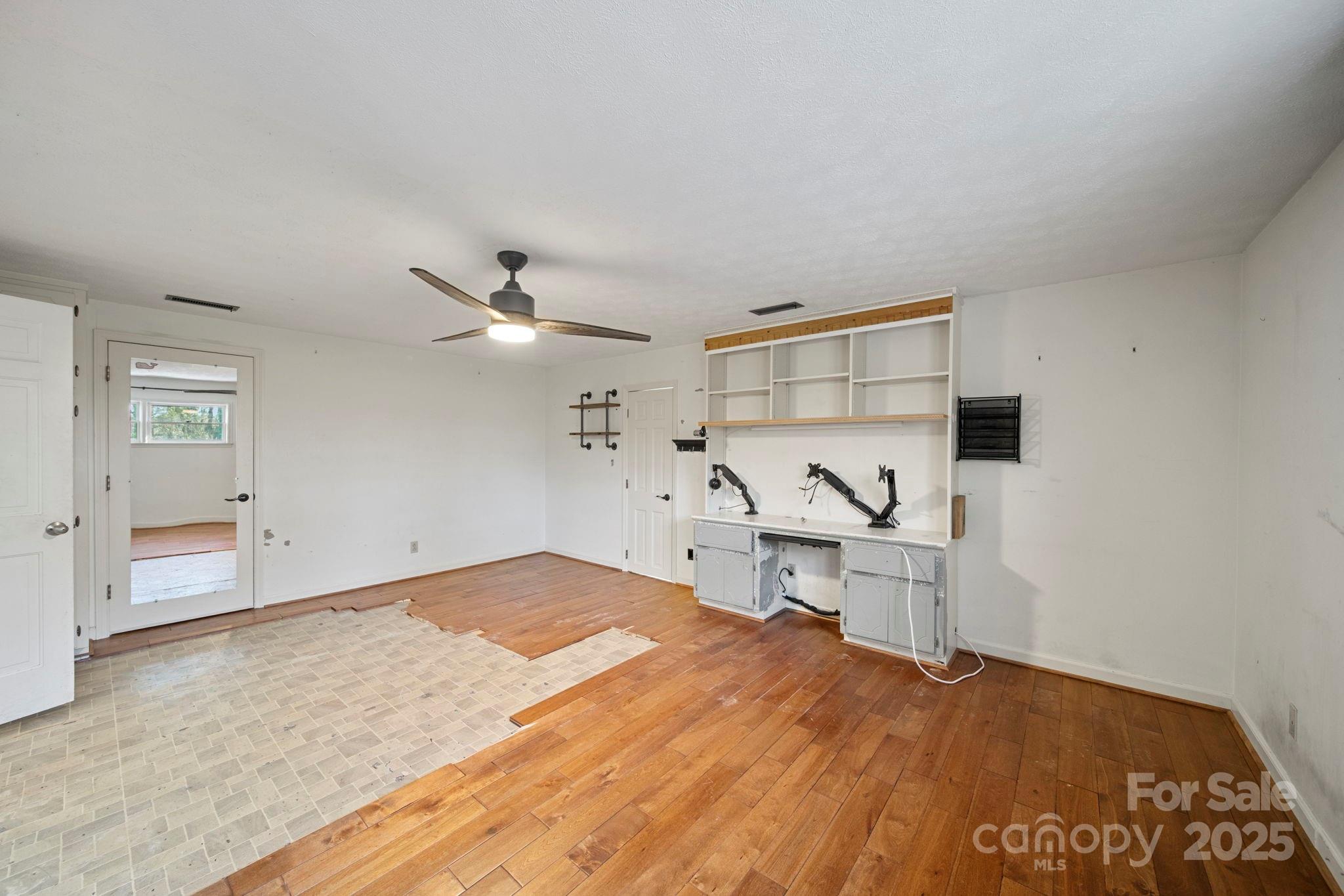 415 Love Lane Rockingham, NC 28379 - Photo 29 of 46 a bedroom with a bed and a view of kitchen