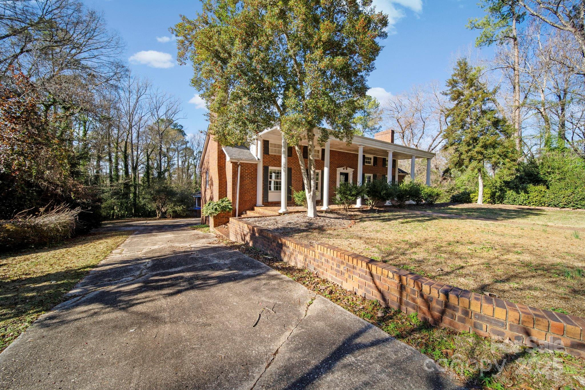 415 Love Lane Rockingham, NC 28379 - Photo 4 of 46 a swimming pool with trees in front of it