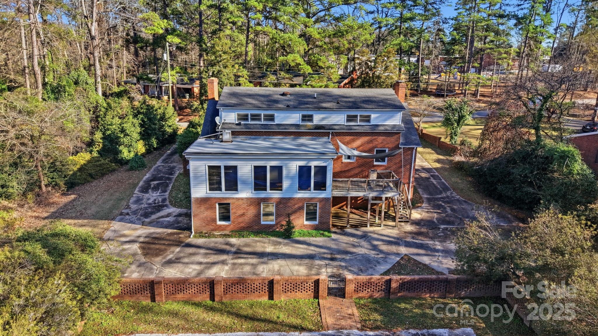 415 Love Lane Rockingham, NC 28379 - Photo 42 of 46 an aerial view of a house with a yard