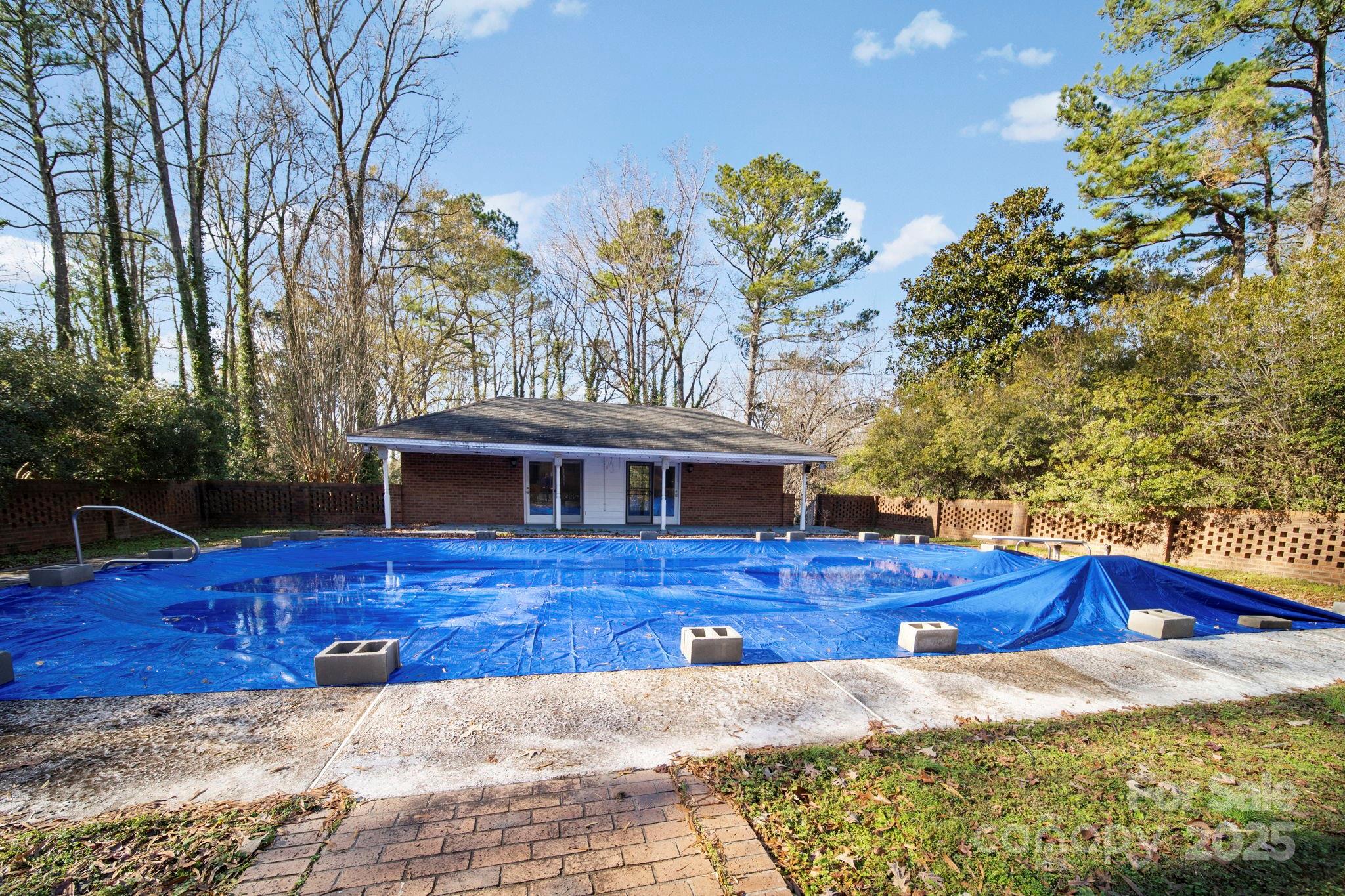 415 Love Lane Rockingham, NC 28379 - Photo 6 of 46 a view of a house with wooden fence