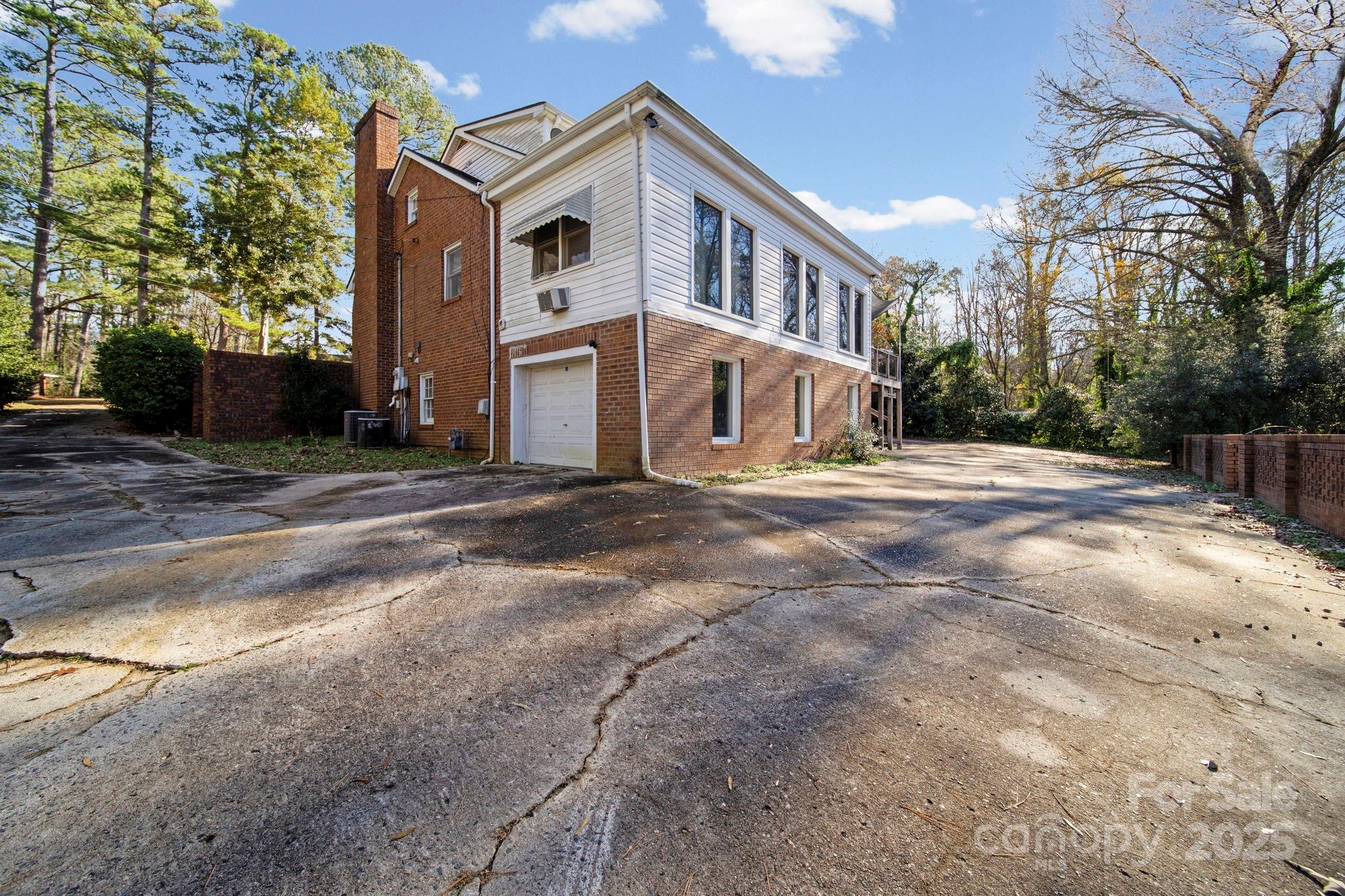 415 Love Lane Rockingham, NC 28379 - Photo 9 of 46 a front view of a house with a yard