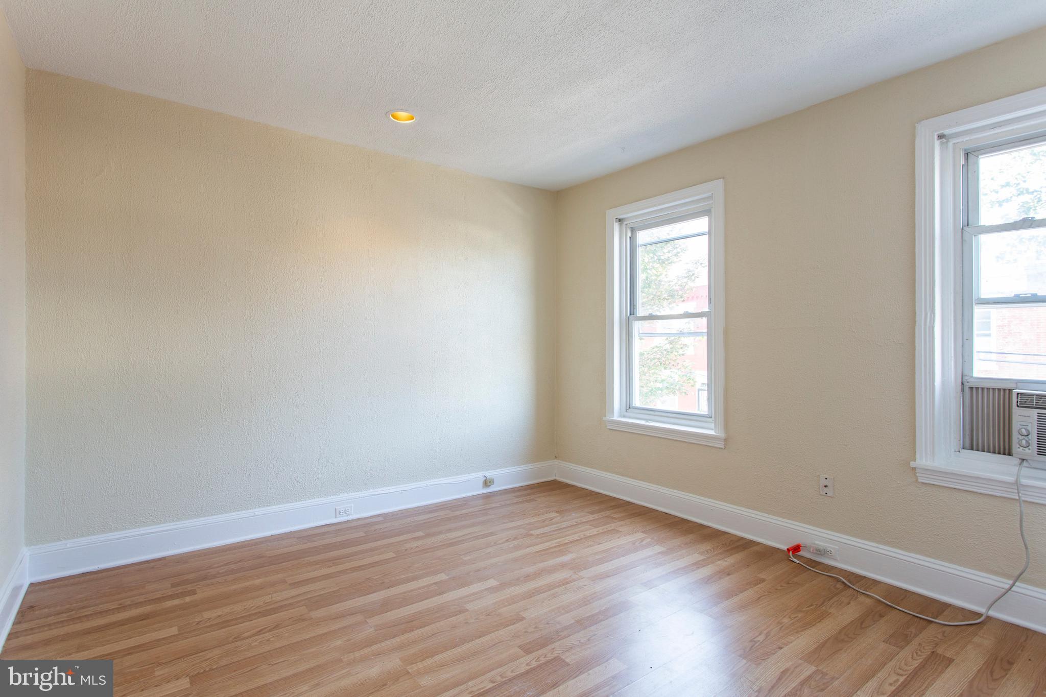 3911 Warren Street Philadelphia, PA 19104 - Photo 14 of 30 a view of an empty room with wooden floor and a window