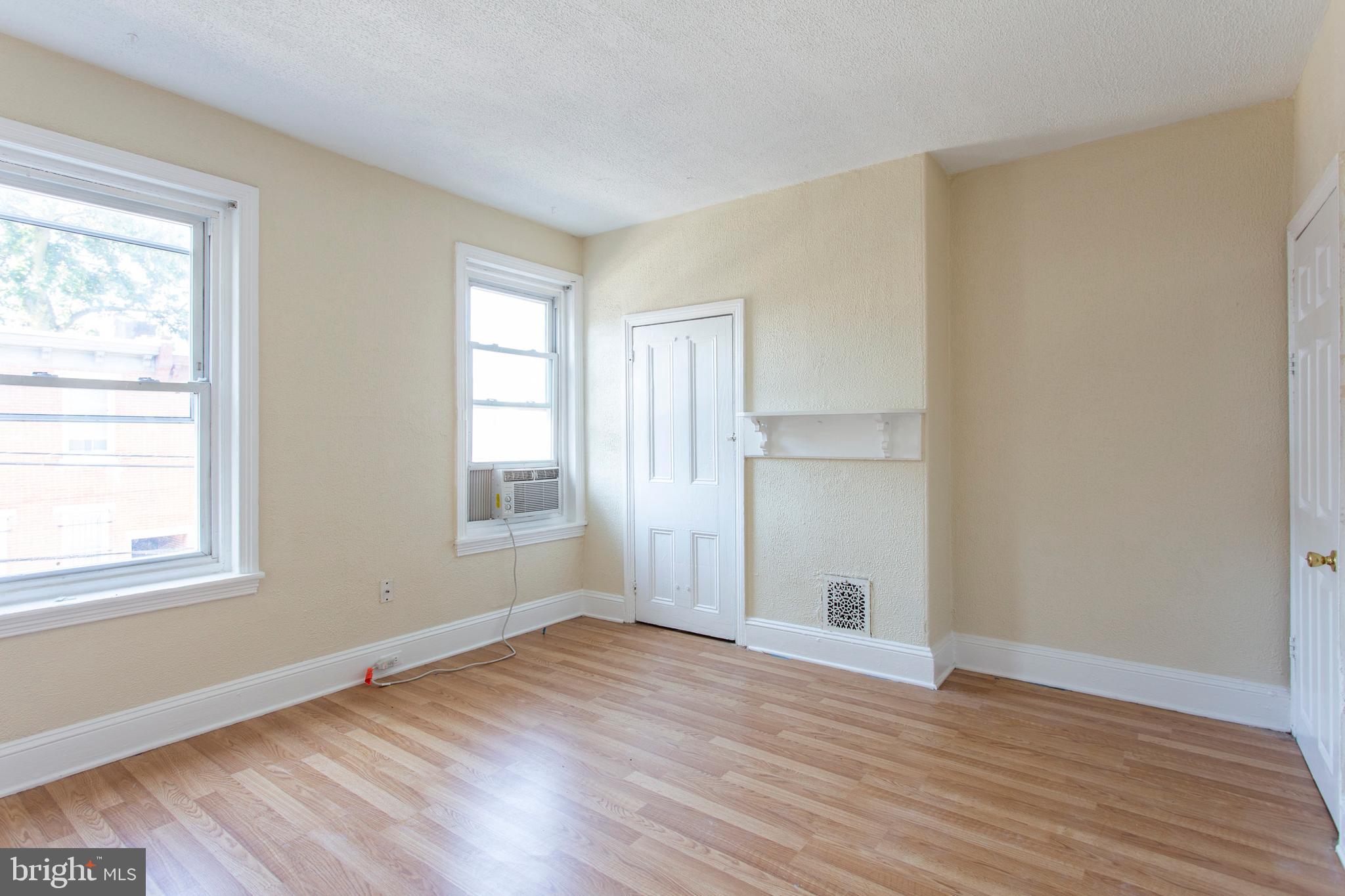 3911 Warren Street Philadelphia, PA 19104 - Photo 15 of 30 an empty room with wooden floor and windows
