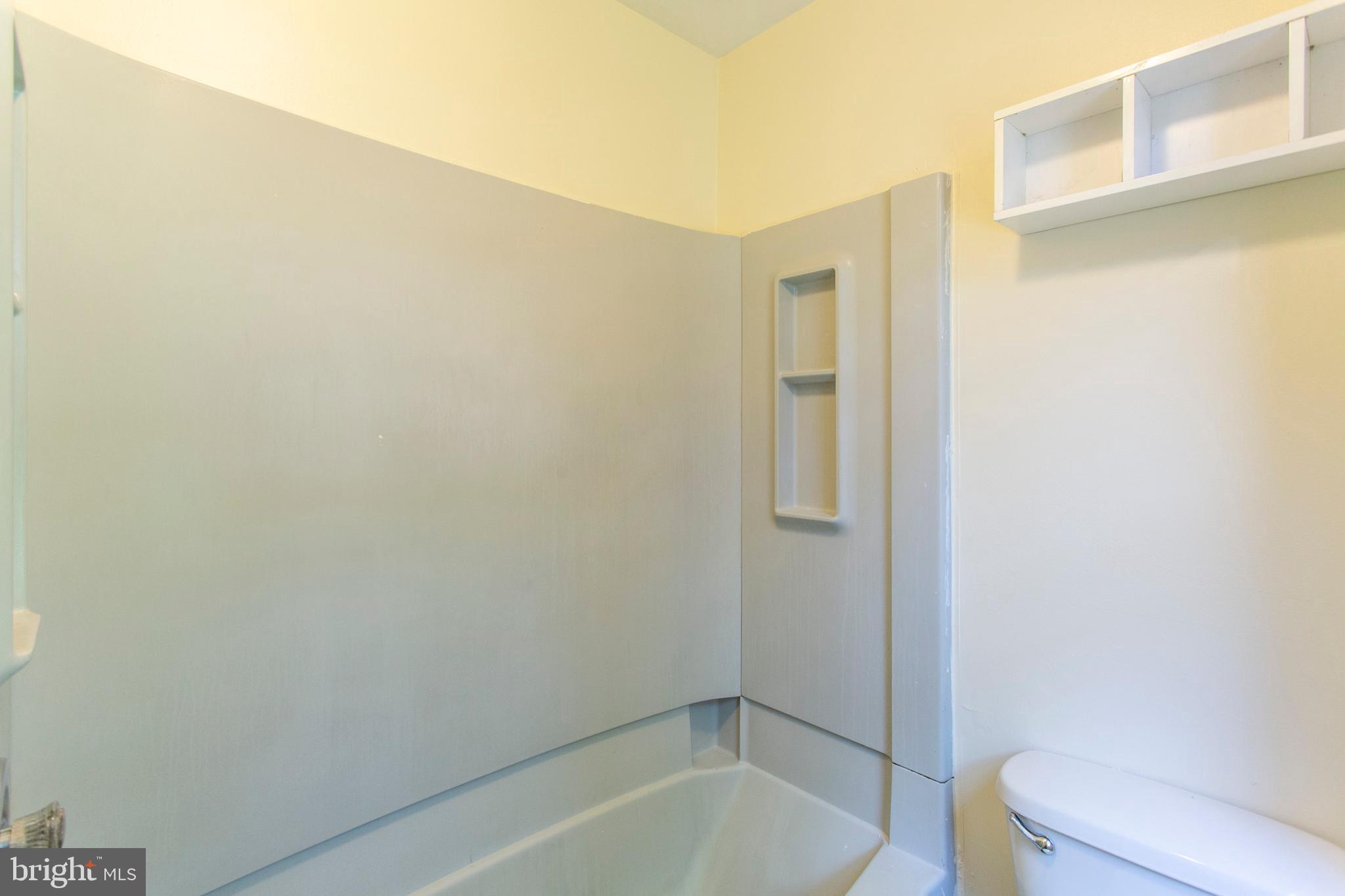 3911 Warren Street Philadelphia, PA 19104 - Photo 21 of 30 a bathroom with a bathtub