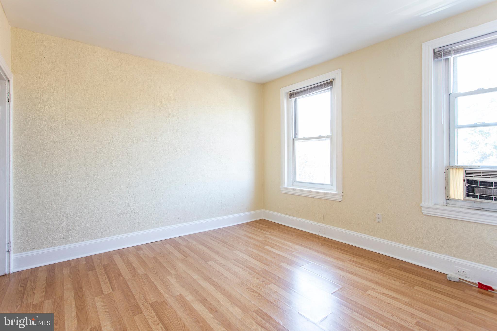 3911 Warren Street Philadelphia, PA 19104 - Photo 22 of 30 a view of an empty room with wooden floor and a window