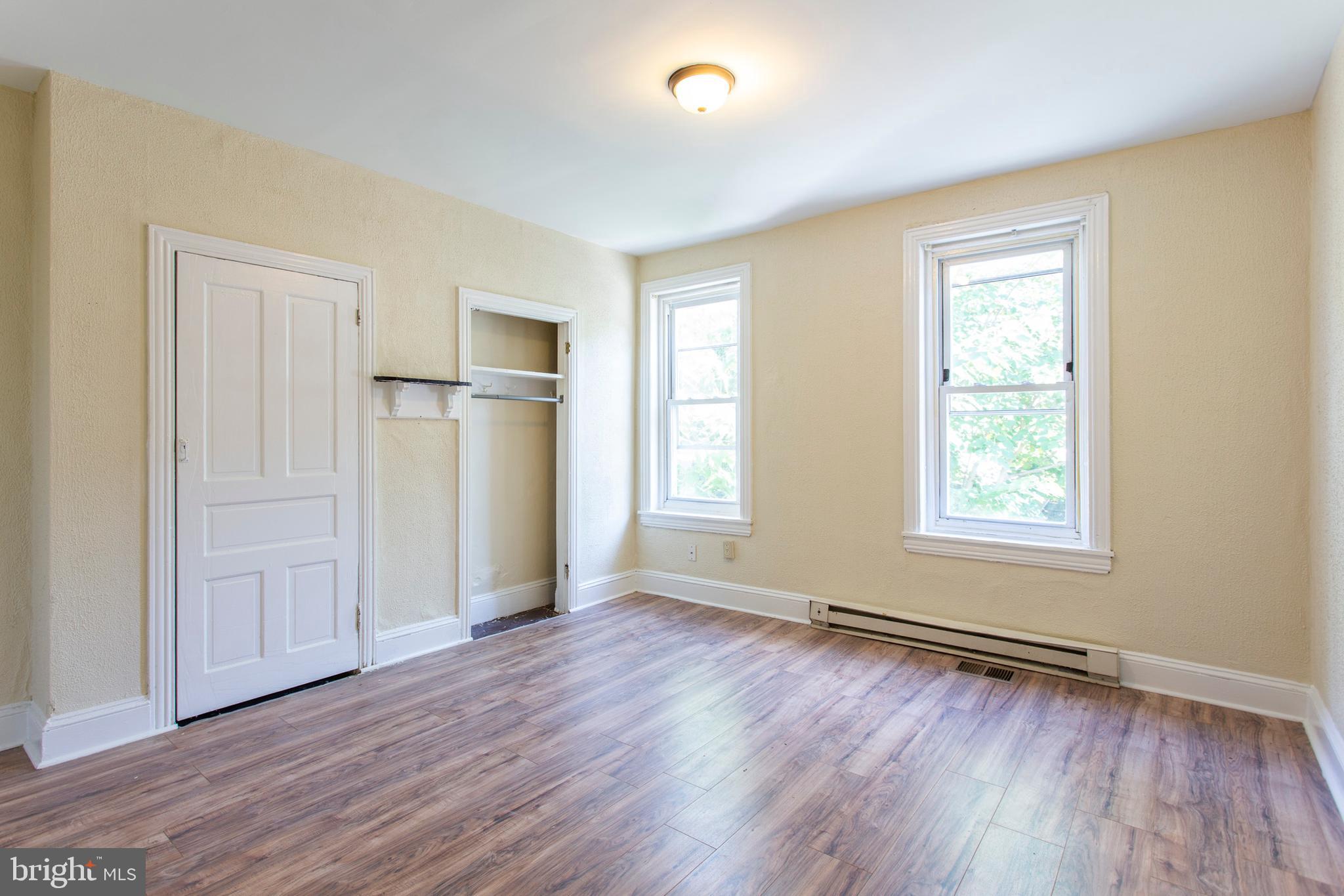 3911 Warren Street Philadelphia, PA 19104 - Photo 26 of 30 an empty room with wooden floor and windows