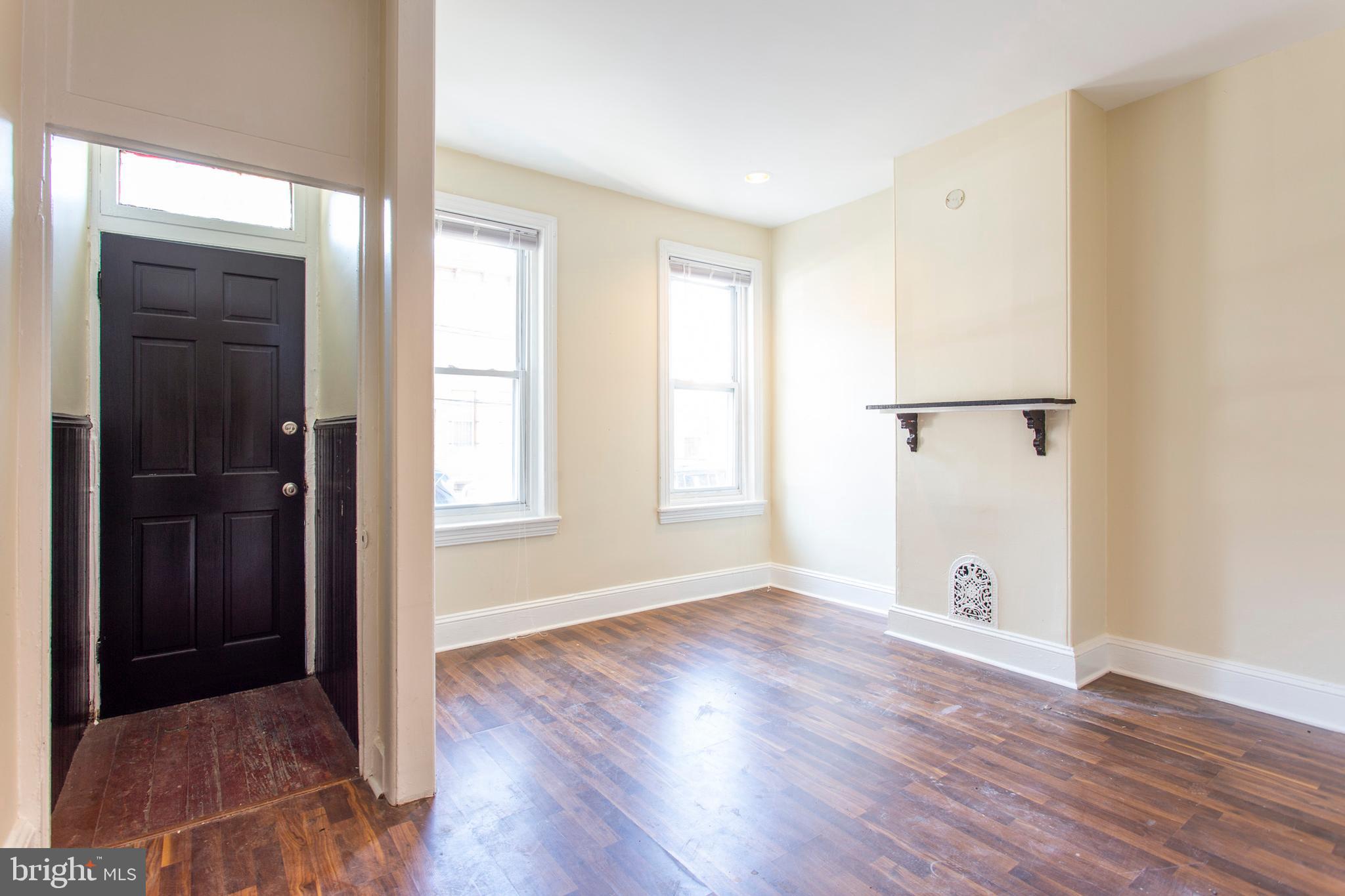 3911 Warren Street Philadelphia, PA 19104 - Photo 28 of 30 an empty room with wooden floor and windows