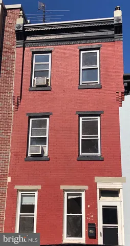a kitchen with refrigerator cabinets and a sink