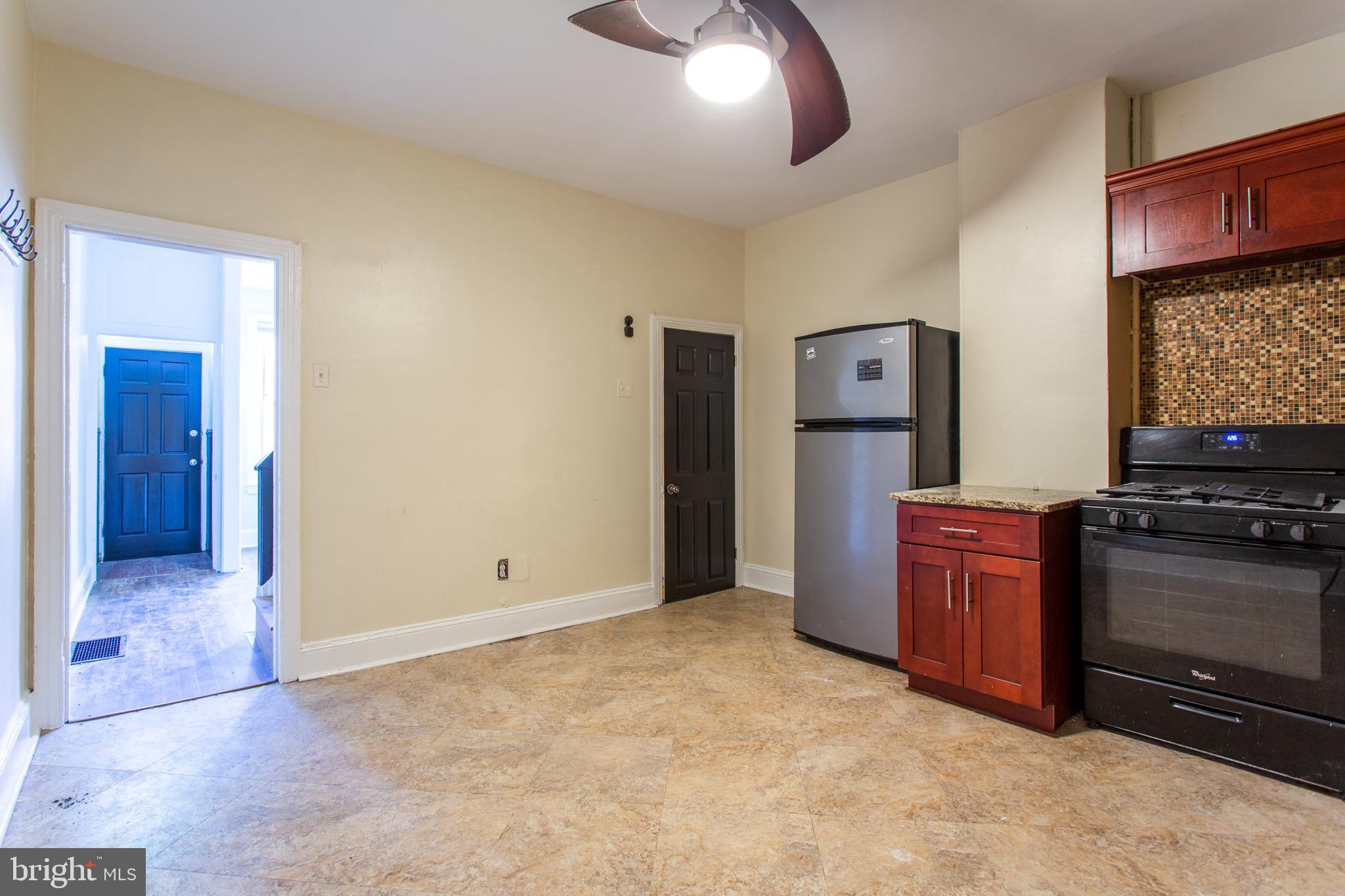 3911 Warren Street Philadelphia, PA 19104 - Photo 8 of 30 a kitchen with stainless steel appliances granite countertop a refrigerator and a stove