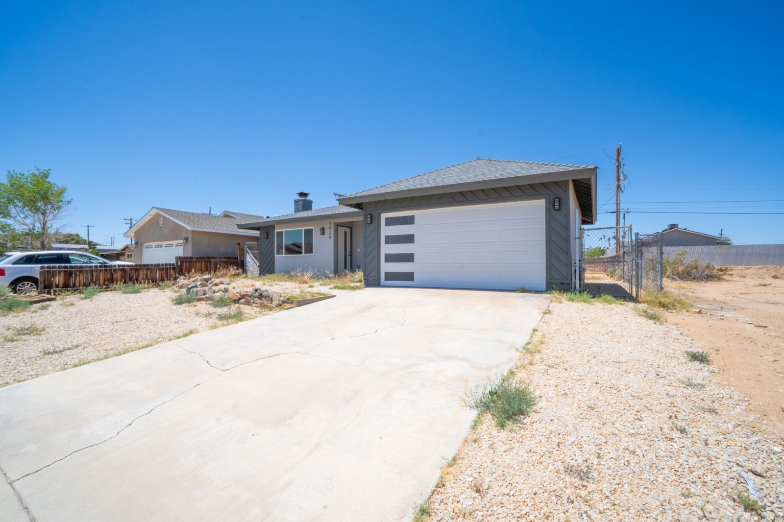 1529 Mayo Street Ridgecrest, CA 93555 - Photo 4 of 22 a front view of a house with a yard