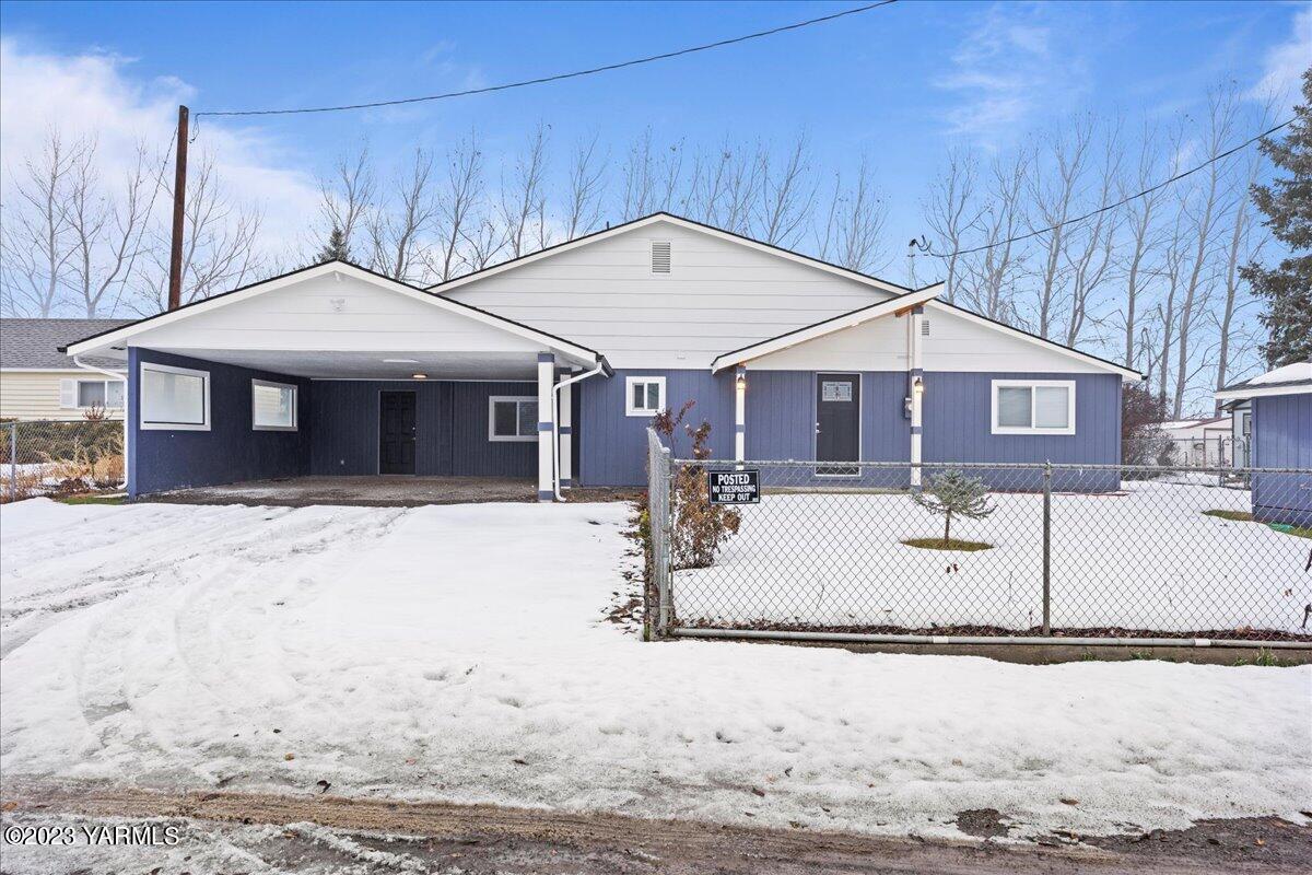 191 Klockhamer Road Naches, WA 98937 - Photo 1 of 28 a view of a white house with a yard covered in snow