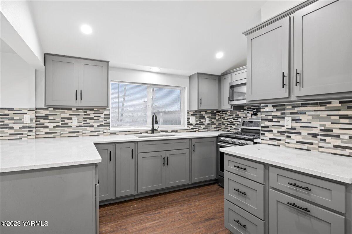 191 Klockhamer Road Naches, WA 98937 - Photo 17 of 28 a kitchen with granite countertop a sink and cabinets